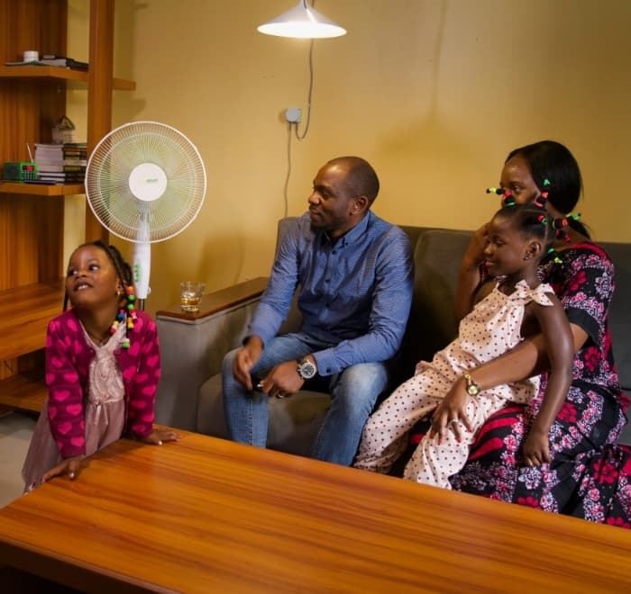 Nigerian Family enjoying clean solar power with Hive Finance